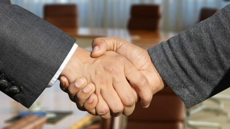 handshake-16-9 business partners shaking hands